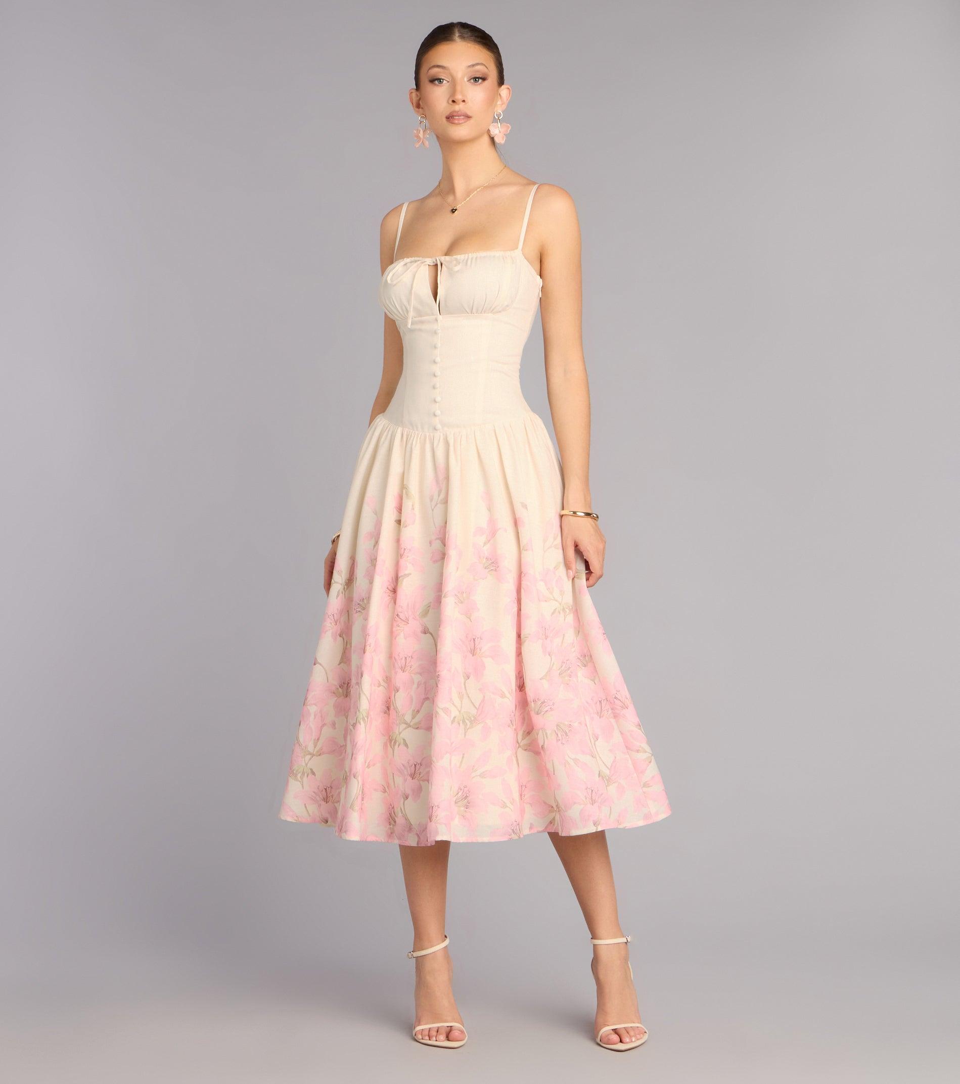 05102-000481_1_WHITE_02FLORALSQUARENECKSPGSTRAPDROPWAISTWTIEANDBUTTONSTEALENGTHMIDI05102000481010_212fe405-9fda-4926-82cf-2719323c6ca7