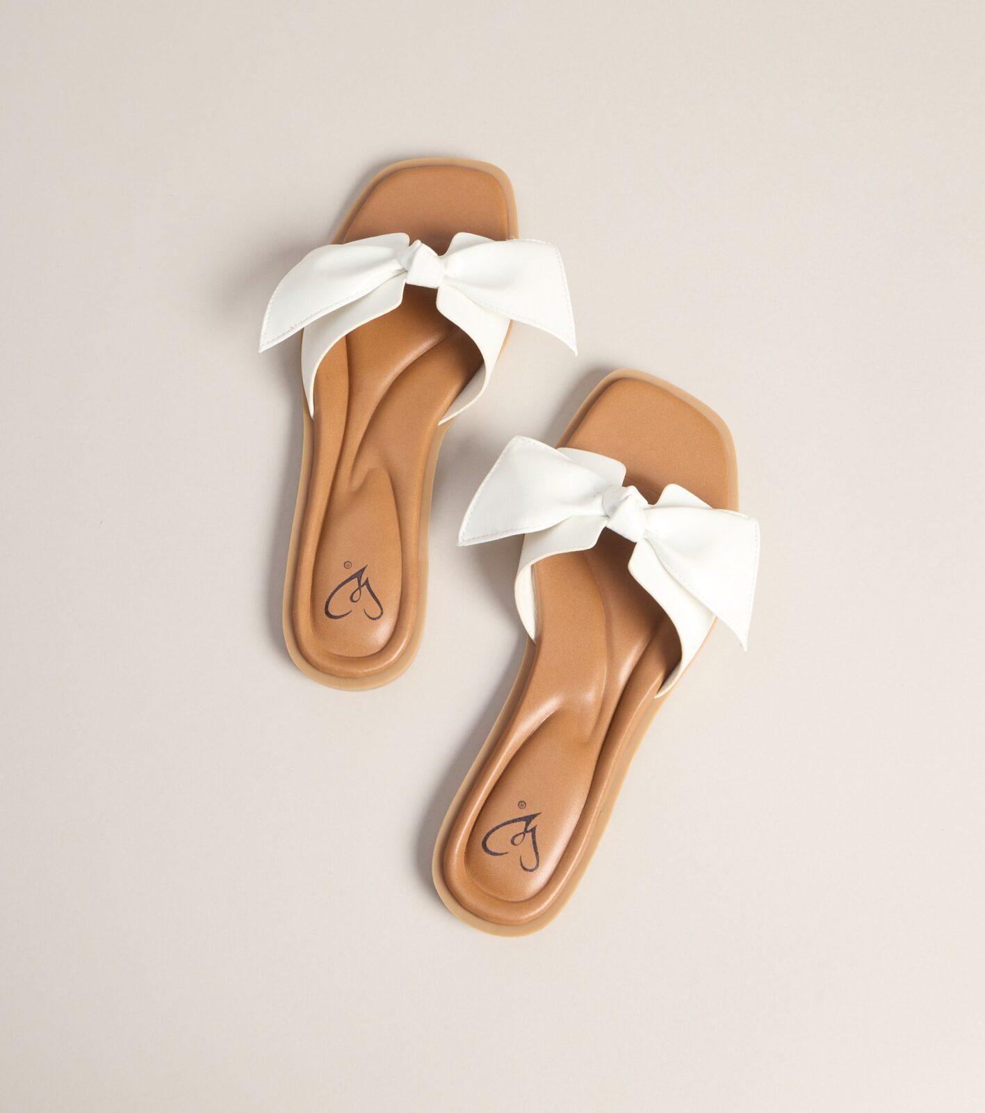 07404-000072_1_WHITE_BOWFLATSANDAL07404000072010_ab75f094-253d-436a-bab3-a65a80384b65
